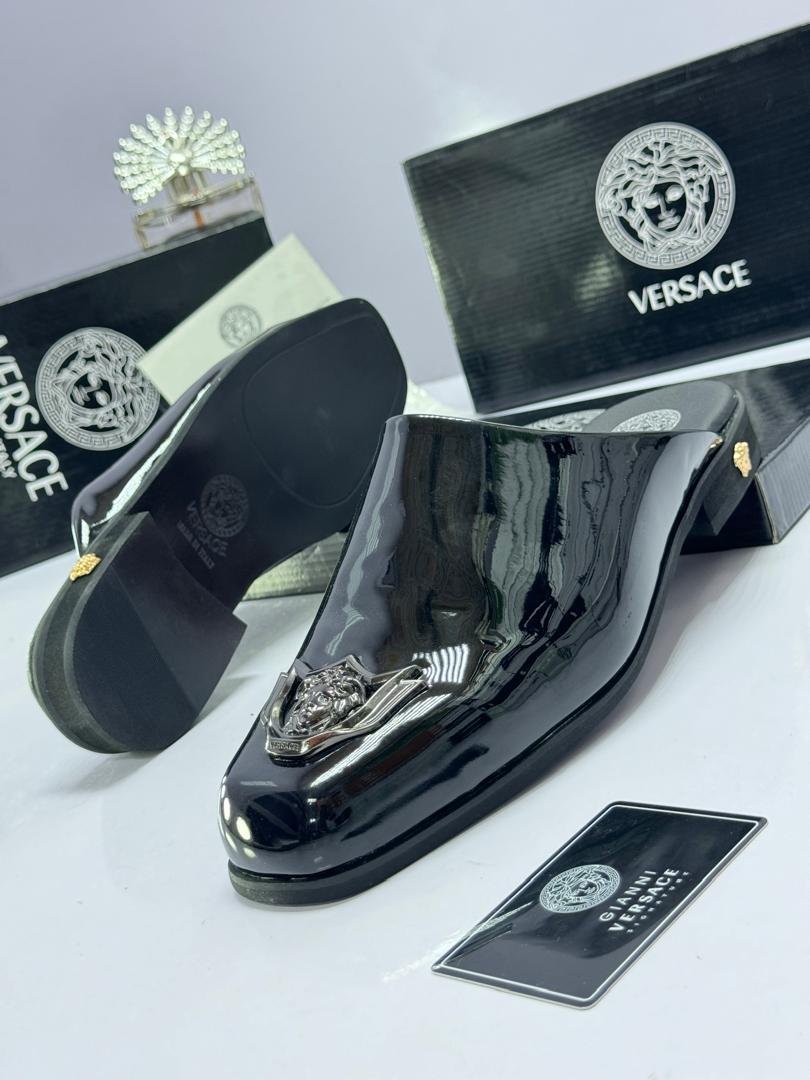 Black-Patent-Leather-Mules-with-Silver-Medusa-Plaque.jpg Black Patent Leather Mules with Silver Medusa Plaque - Image 1
