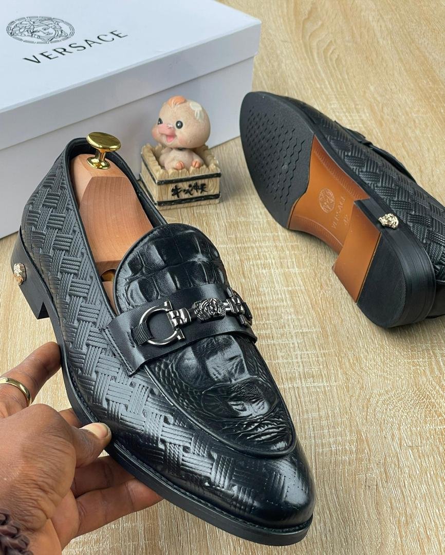 Mens-Woven-Leather-Slip-On-Loafers-with-Medusa-Charm.jpg Men’s Woven Leather Slip-On Loafers with Medusa Charm - Image 1