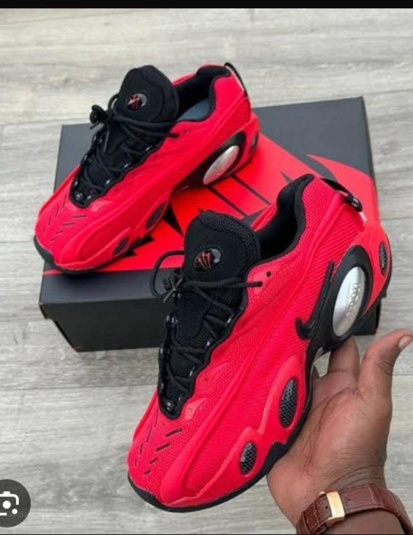 Nike-x-NOCTA-Glide-Bright-Crimson-Sneakers.jpg Nike x NOCTA Glide “Bright Crimson” Sneakers - Image 1