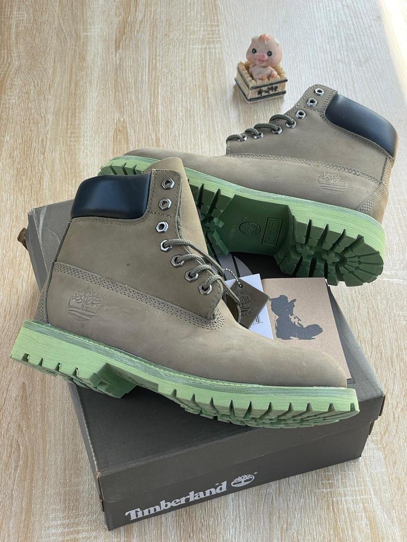 Rugged-Leather-Boots-with-Distinct-Green-Sole.jpg Rugged Leather Boots with Distinct Green Sole - Image 1