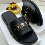 Black Textured Slide Sandals with Gold Medusa Emblem
